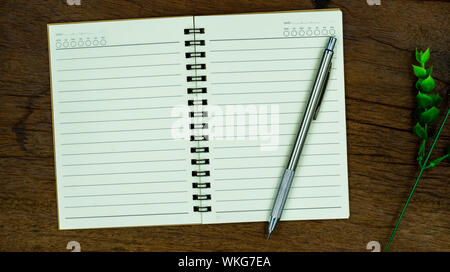 Feather pen and blank notebook page Stock Photo by haveseen