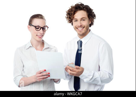 Business executives analyzing annual report Stock Photo