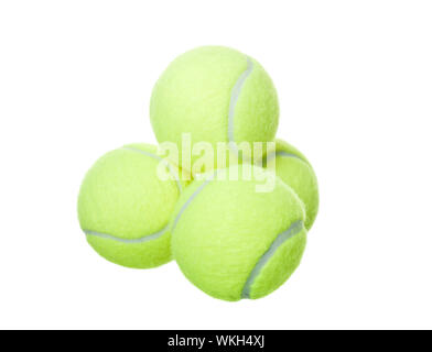 Pyramid of tennis balls isolated on white background Stock Photo