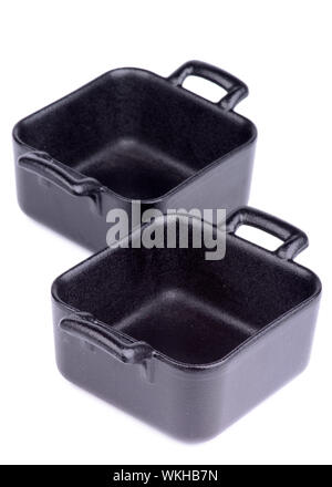 Two Little Portion Cast-iron Square Shape Stew Pots isolated on white background Stock Photo