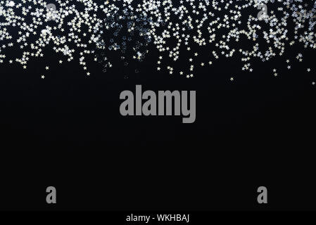 Star shaped silver sequins background. Copy space. Stock Photo
