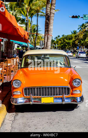 MIAMI BEACH - MARCH 20. Vintage Car Parked along Ocean Drive in the Famous Art Deco District in South Beach. South Beach, FL, JANUARY 22, 2014. Stock Photo