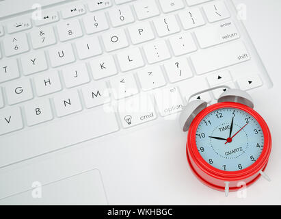 Alarm clock on the keyboard. View from above Stock Photo