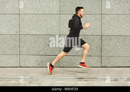 Athlete in motion. Profile view of young fitness sportive girl in sports  uniform runnin, training isolated over white backgrund. Running technique  Stock Photo - Alamy