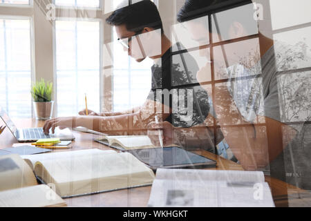 man studying design lesson with graphic tablet. college student learning online taking note Stock Photo