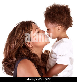 Portrait of cheerful mother kissing baby, studio shot, happy motherhood, lovely African family, happiness and love concept Stock Photo