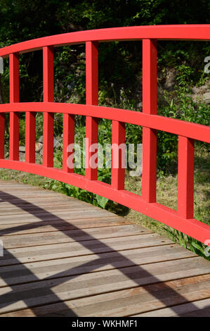 Balustrade Detail of Red Wooden Japanese Bridge in Japanese Garden of Kamaishi Musée Promenade Digne-les-Bains Alpes-de-Haute-Provence Provence France Stock Photo