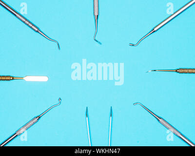 Dental instrument on blue background with copy space. Dental care concept Stock Photo