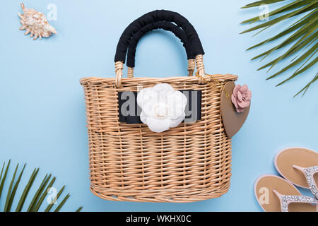 An elegant woman's handbag with light blue leather handle and canvas  printed with a butterfly design Stock Photo - Alamy