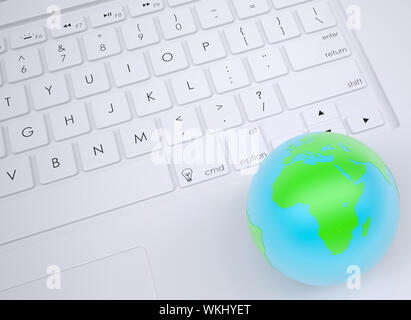 Earth on the keyboard. View from above Stock Photo