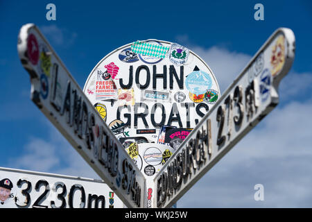 Distance marker direction signs at John O' groats on the North Coast 500 tourist motoring route in northern Scotland, UK Stock Photo