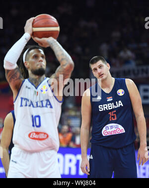Foshan, China's Guangdong Province. 4th Sep, 2019. Nikola Jokic (R) of Serbia reacts as Daniel Hackett of Italy aims to shoot the ball during the group D match at the 2019 FIBA World Cup in Foshan, south China's Guangdong Province, Sept. 4, 2019. Credit: Huang Zongzhi/Xinhua/Alamy Live News Stock Photo