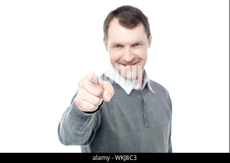 Happy middle aged man pointing at camera Stock Photo