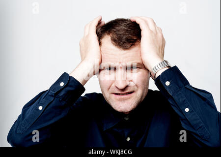 Business executive suffering from headache Stock Photo
