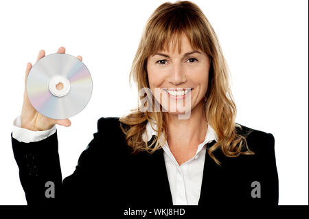 Corporate female executive holding a compact disc Stock Photo