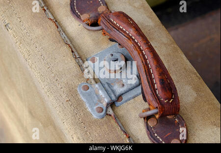 old suitcase brown leather handle and metal lock Stock Photo
