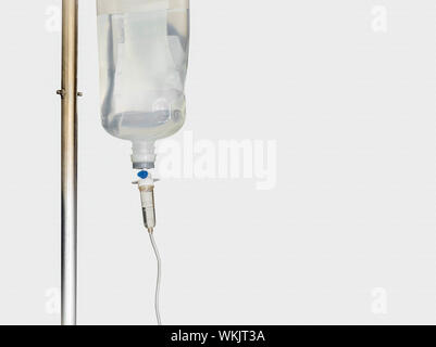 IV intravenous bag with dropper and tube dispose with medicine solution close up Stock Photo