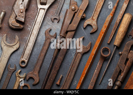Vintage old tools on stone backdrop. Top view closeup. Flat lay Stock Photo