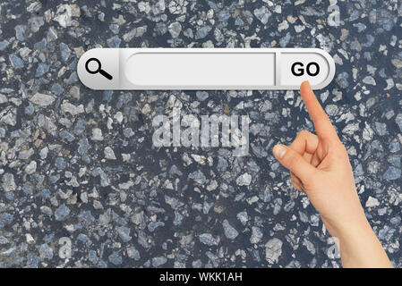 Human hand indicates the search bar in browser. Dark asphalt surface on background Stock Photo