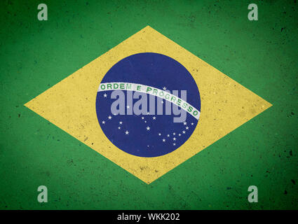 Full frame grunge close-up of Brazilian flag on textured concrete wall background Stock Photo
