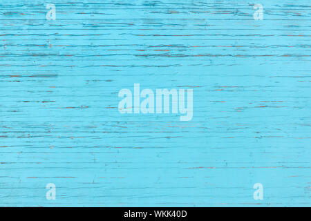 Light blue, partly heavily weathered wooden wall Stock Photo