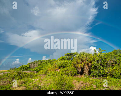 Rainbow over Sanibel Island Lighthouse Beach Park on the Gulf of Mexico on Sanibel Island Florida Stock Photo