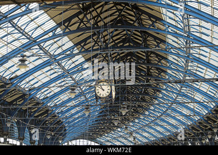 Brighton Railway Station historic building train shed interior view  glass and iron roof construction and clock England Great Britain UK  KATHY DEWITT Stock Photo