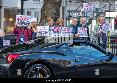Brentwood, Essex, UK. 4th September 2019 Mini 'Defend democracy' protest in the High Street of Brentwood, Essex, UK with 2012 Ferrari 458 Italia Dct . Credit: Ian Davidson/Alamy Live News