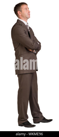 Businessman stands in half-turn. Isolated on the white background. Stock Photo