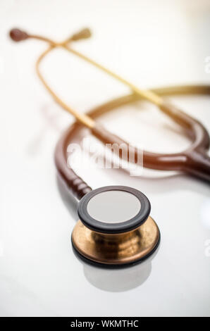 Stethoscope on doctors table, medicine background Stock Photo