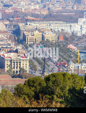 Barcelona, Spain - February 22, 2019 - Mirador de Colom (Christopher Columbus Monument) as viewed from Monjuic Castle. It is a famous landmark in the Stock Photo