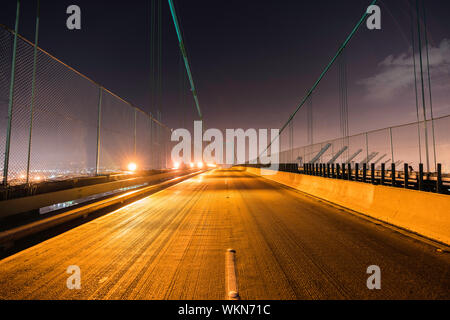 Night view of Vincent Thomas Bridge above the Port of Los Angeles, Terminal Island and San Pedro in Southern California. Stock Photo
