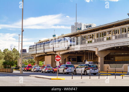 Las Vegas, NV / USA – May 11, 2019: Monorail station and a line of waiting taxis cabs at the  rear of the MGM Grand Hotel in Las Vegas, Nevada. Stock Photo