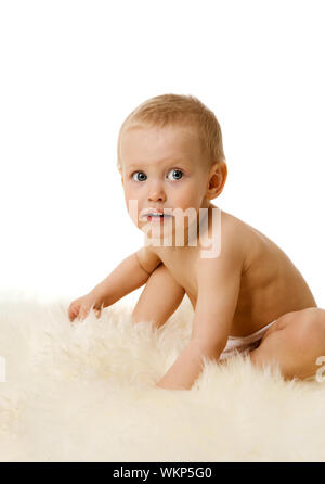 Toddler girl sitting wearing diaper isolated on white Stock Photo