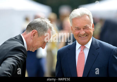 Nigel Evans MP (Con: Ribble Valley) talking to Sir Alan Duncan (Con: Rutland and Melton) on College Green, Westminster, before a historic Brexit vote Stock Photo