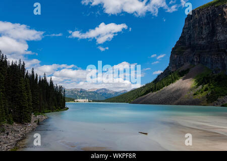 The beautiful Fairmont Chateau Lake Louise and Lake Louise at Banff, Canada Stock Photo