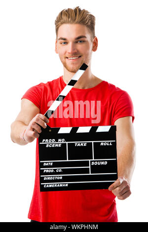 Casual young man holding a clapboard, over a white background Stock Photo