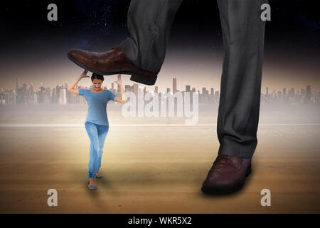 Composite image of businessman stepping on girl against cityscape on the horizon Stock Photo