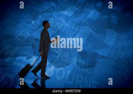 Young businessman pulling his suitcase against airport departures board for australia Stock Photo