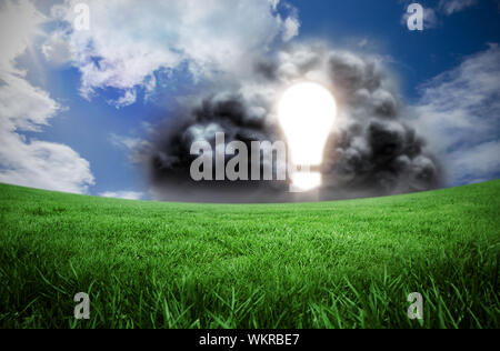 Composite image of light bulb in cloud against green field under blue sky Stock Photo