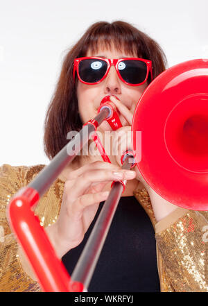 Young Female Musician Playing Trombone - Isolated on White Stock Photo