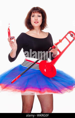 Young Female Musician with Red Trombone Dancing - Isolated on White Stock Photo
