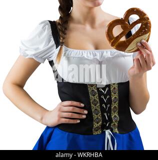 Pretty oktoberfest girl holding pretzel on white background Stock Photo