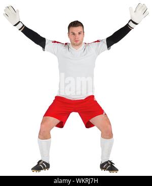 Goalkeeper in white ready to save on white background Stock Photo