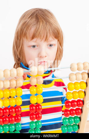 Boy Counting on Colorful Wooden Abacus - Isolated on White Stock Photo