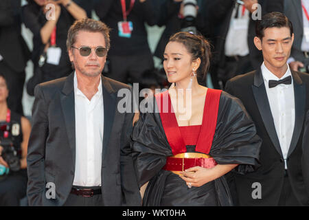 VENICE, Italy. 04th Sep, 2019. Jean-Michel Jarre and Gong Li attend the red carpet for the World Premiere of 'Lan Xin Da Ju Yuan (Saturday Fiction)' during the 76th Venice Film Festival at Palazzo del Cinema on September 04, 2019 in Venice, Italy. Credit: Roberto Ricciuti/Awakening/Alamy Live News Stock Photo