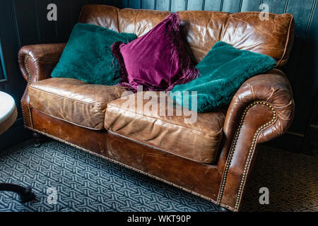 Old brown leather sofa Stock Photo