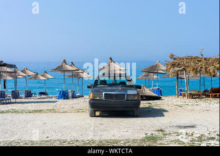 Car standing on the seashore. Borsh Albania Stock Photo