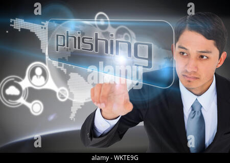 Businessman pointing to word phishing against futuristic technology interface Stock Photo