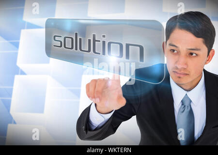 Businessman pointing to word solution against abstract glowing squares Stock Photo